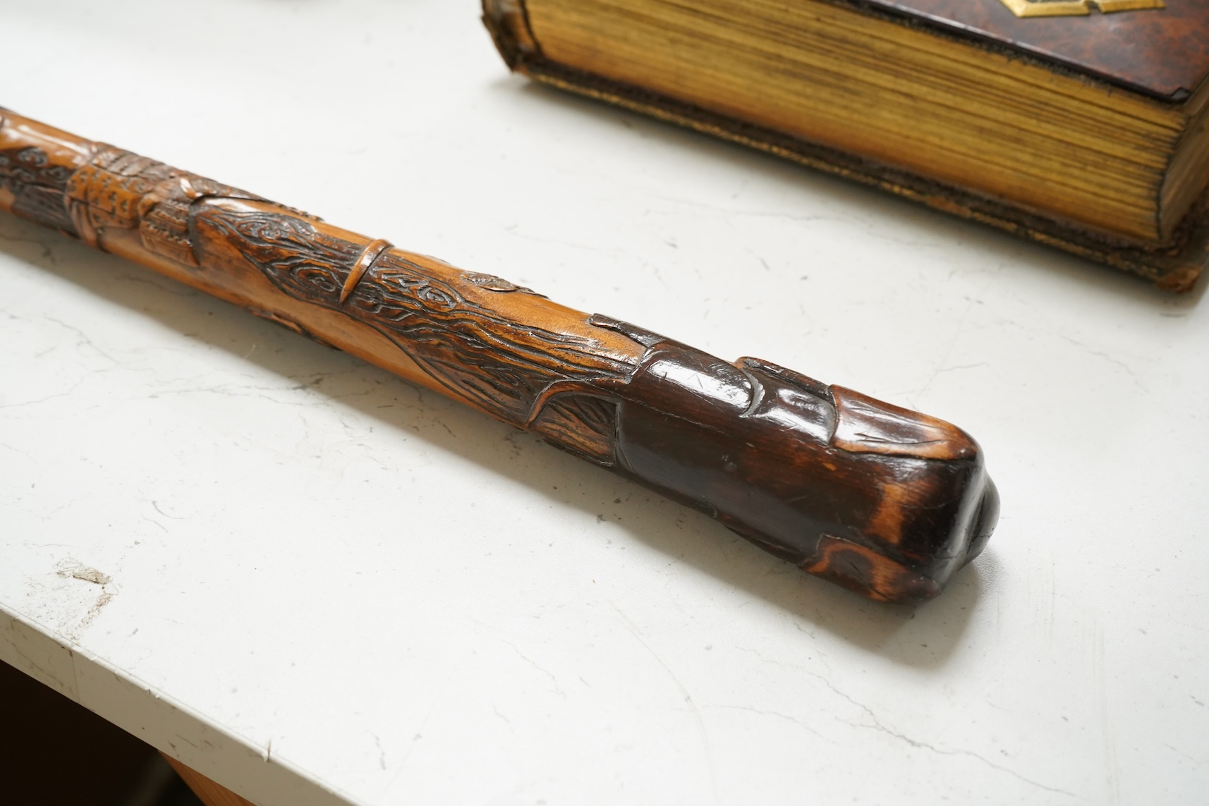 A late 19th century Japanese carved walking stick, with elephant handle, 95cm high